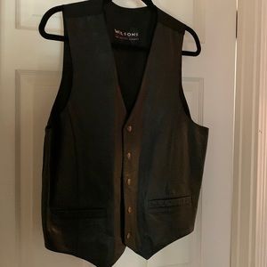 Wilson’s black leather vest.